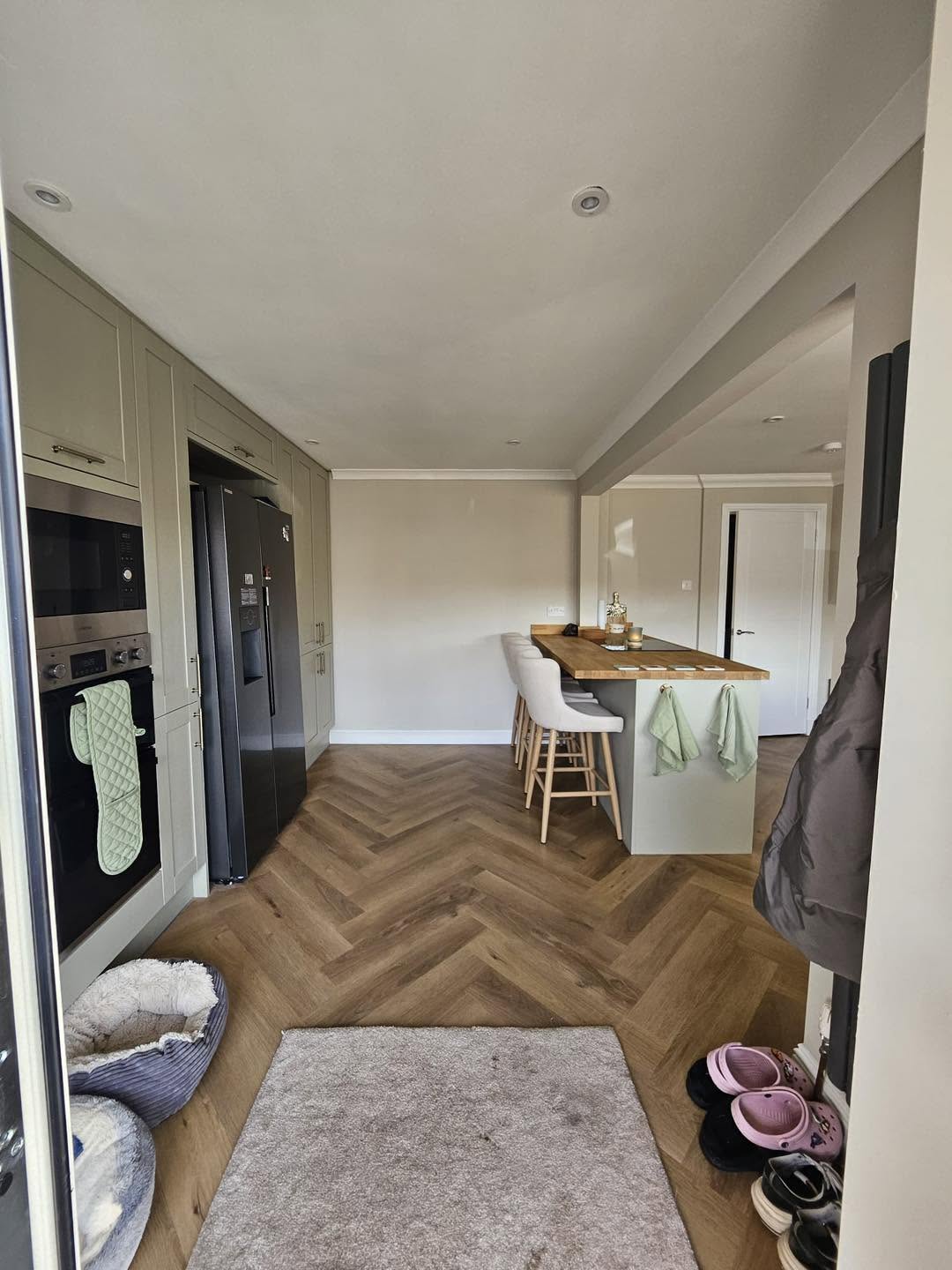 Full kitchen diner extension renovation with herringbone flooring, shaker kitchen cabinetry and dining island by SJ Joinery & Building