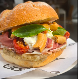 House-made Italian panini filled with prosciutto, fresh ricotta, giardiniera and basil at Strada Food Industry in Glynde