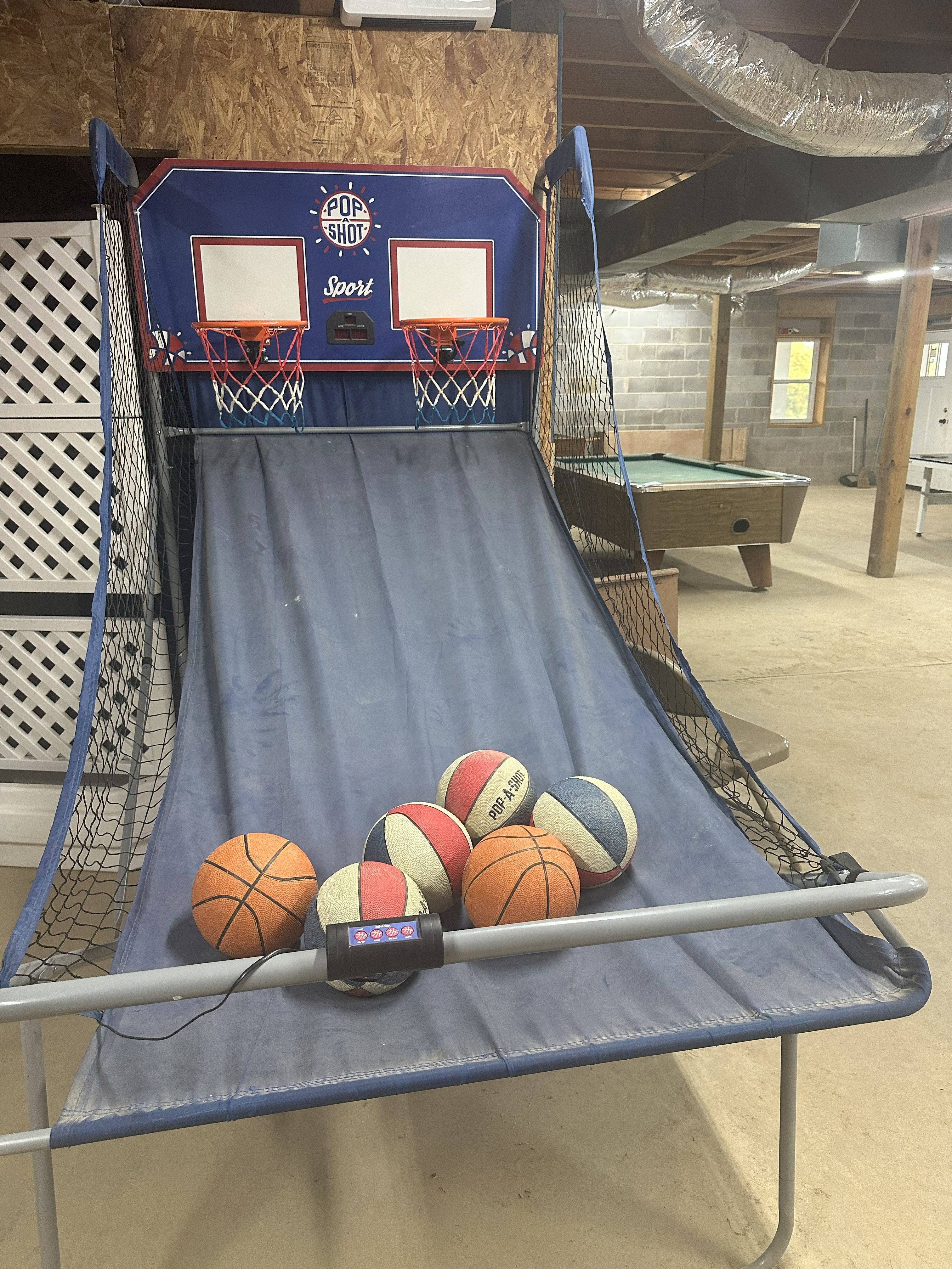 Pop-a-shot dual basketball arcade game in game room