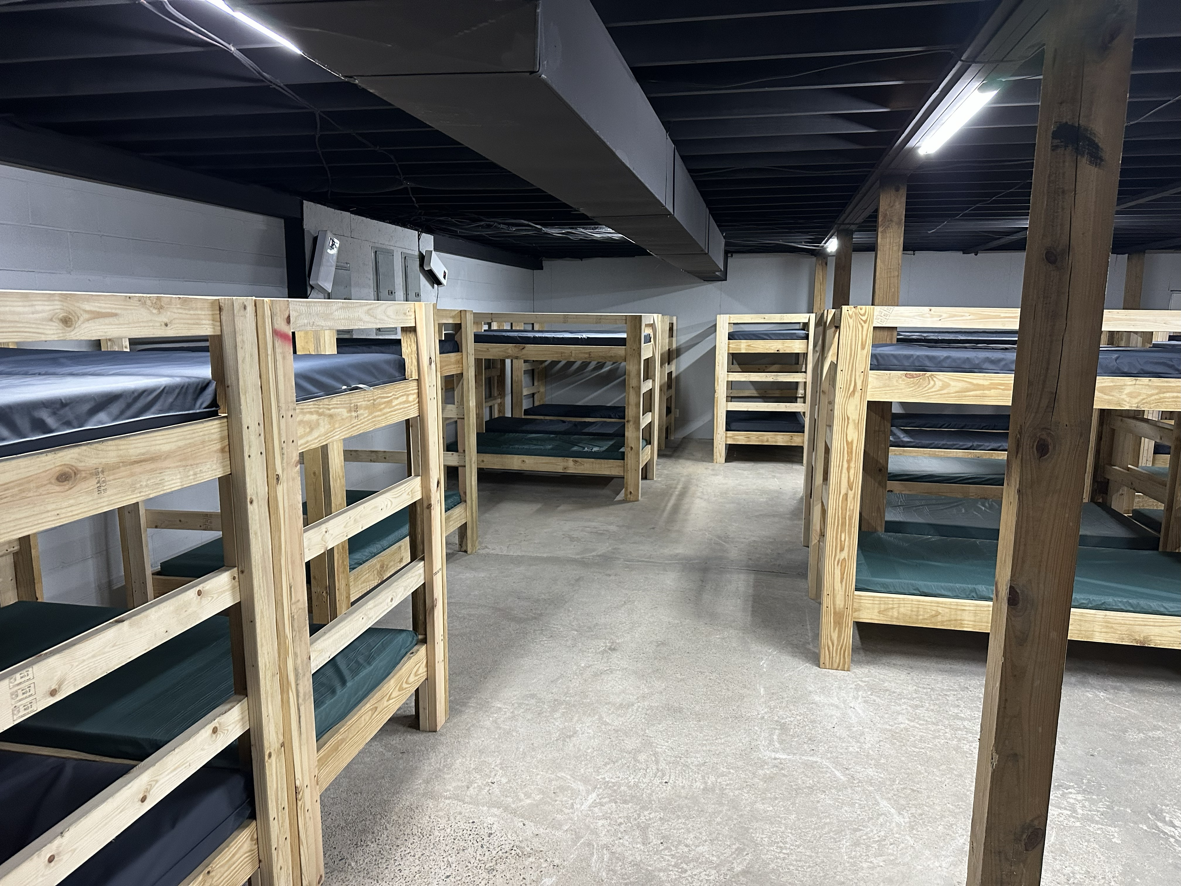 Spacious bunk room rows of handcrafted bunk beds