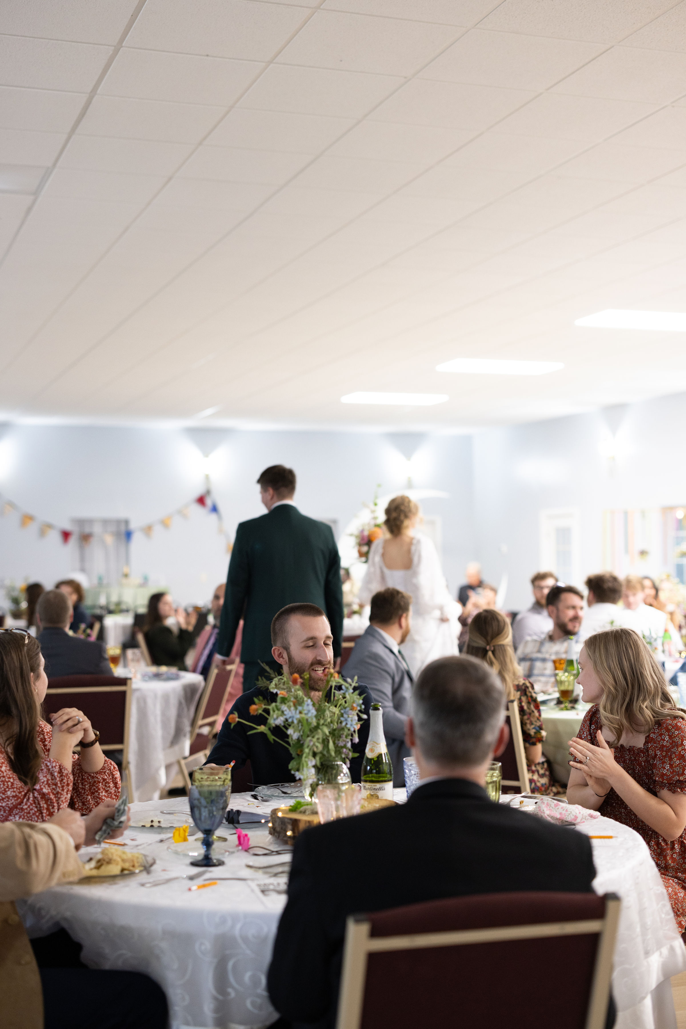 Guests seated for a meal and reception inside the Event Hall