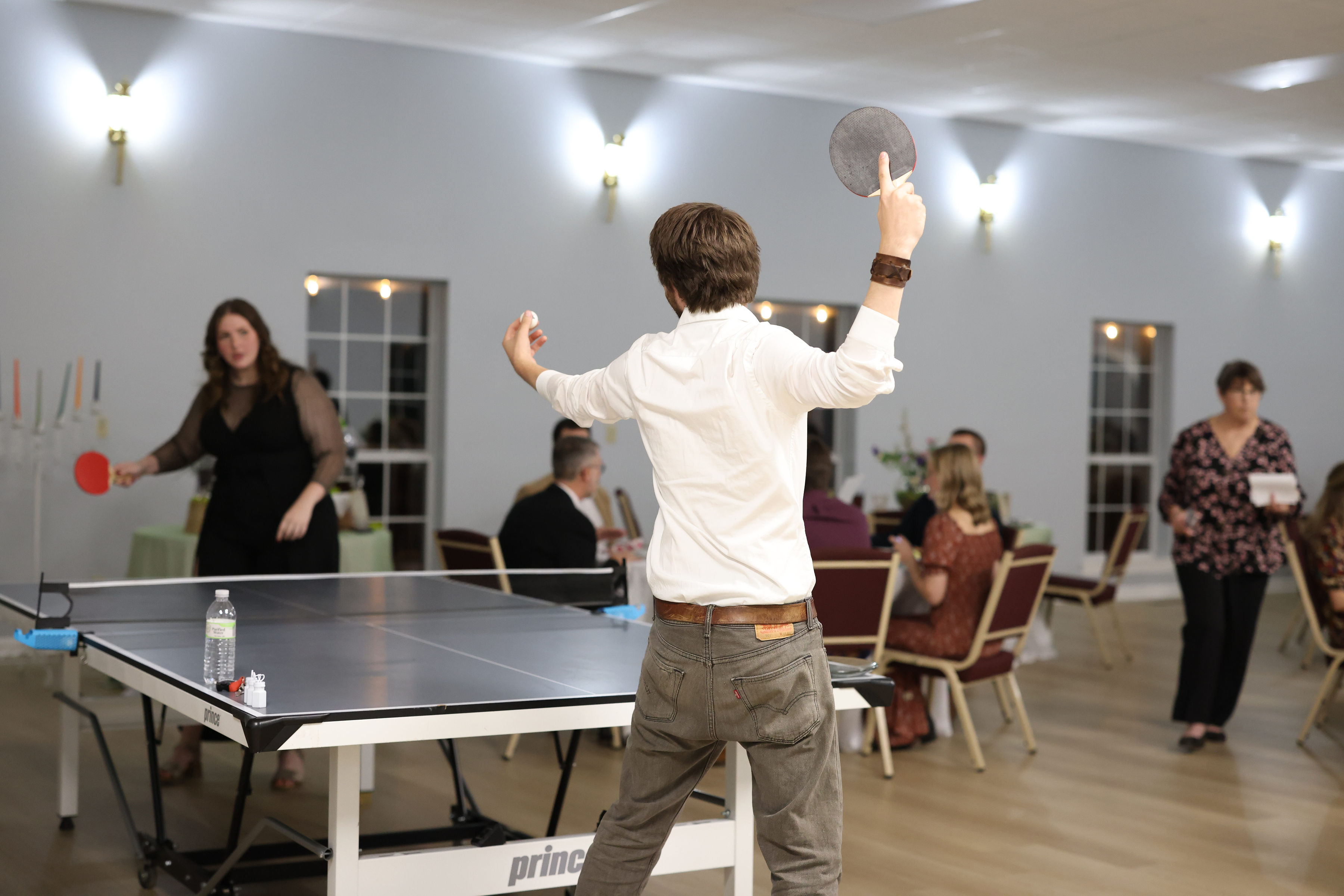 Table tennis and recreation during a gathering in the Event Hall