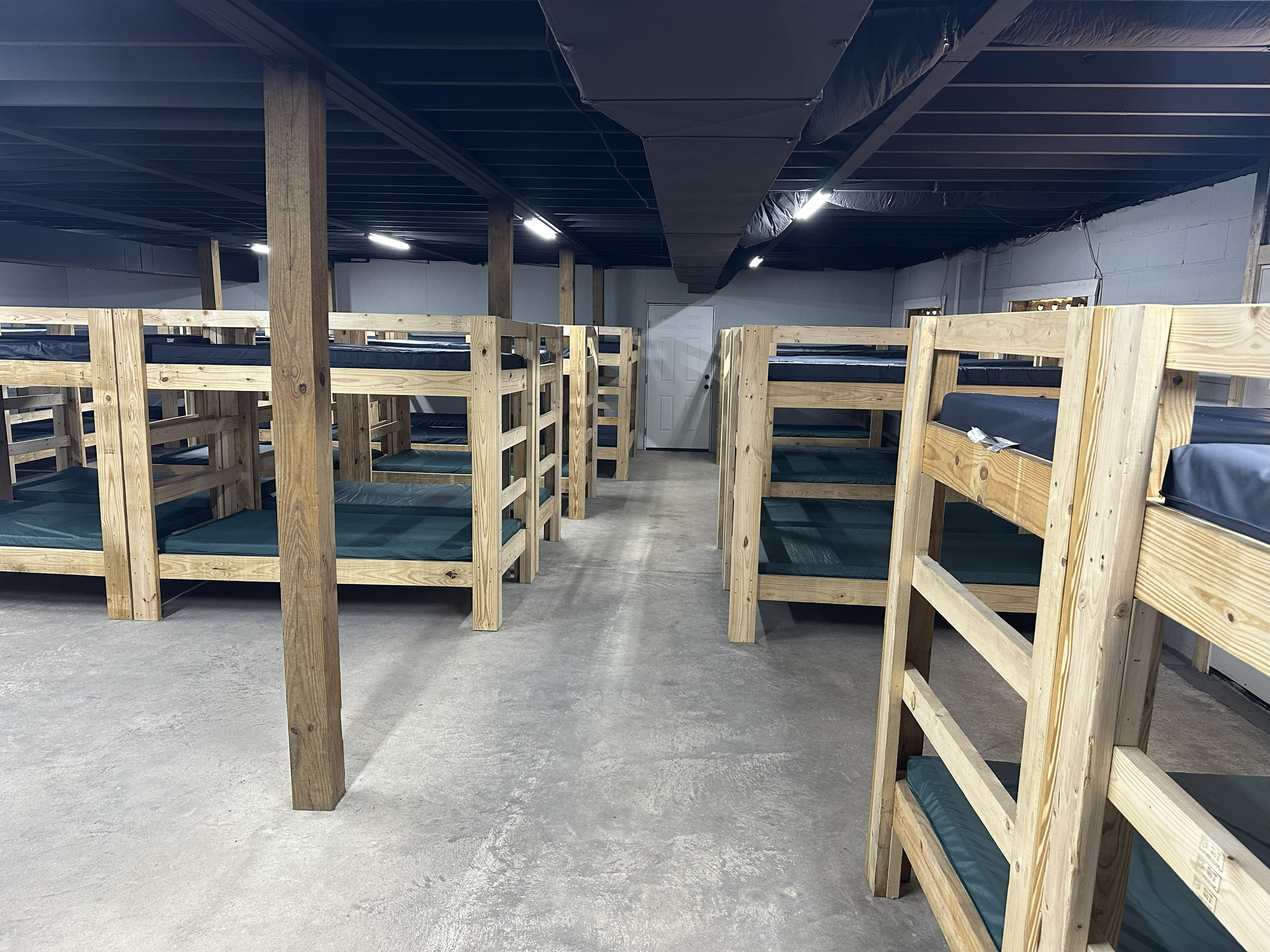 Bunk room lodging with wooden bunk beds