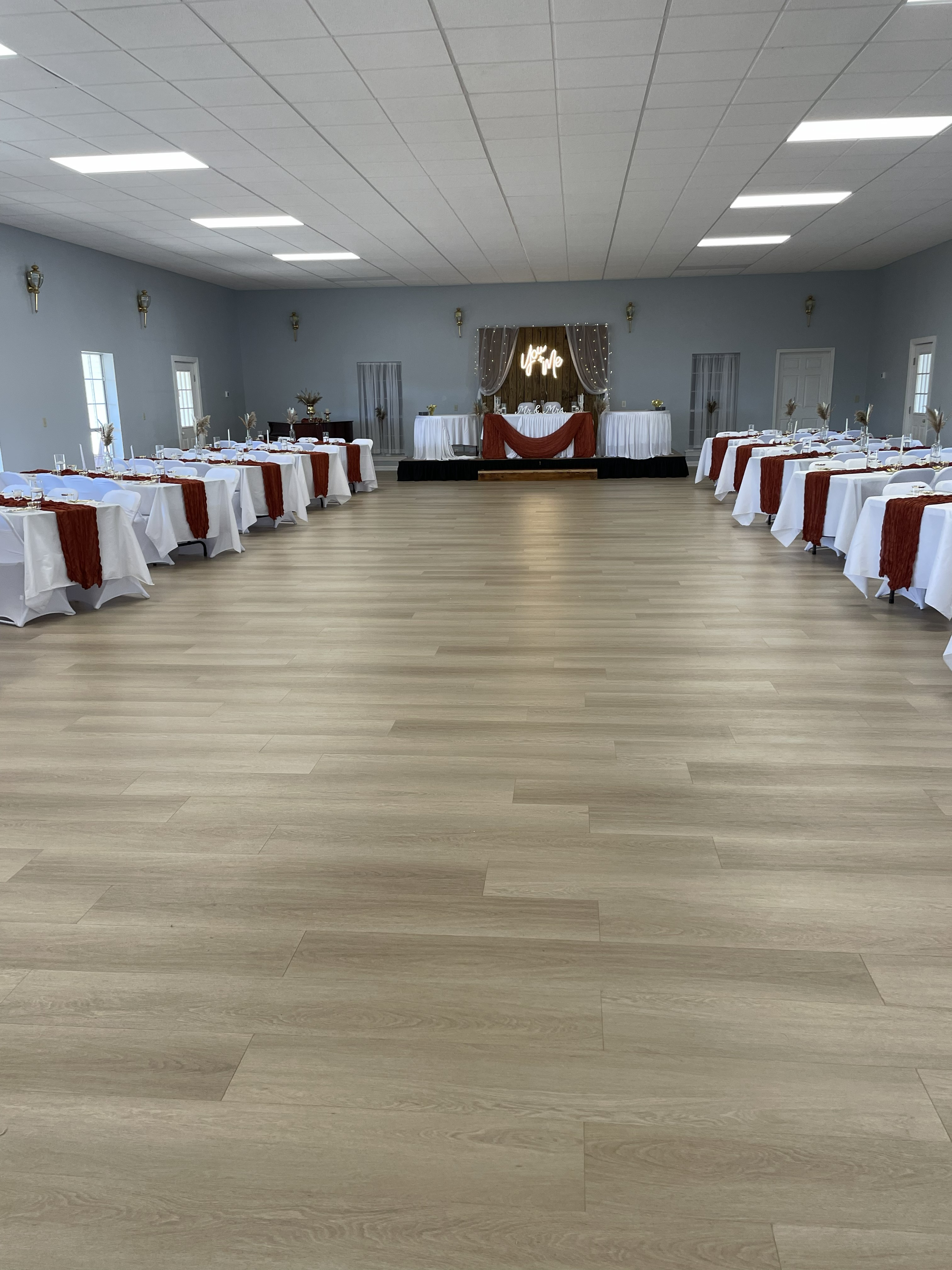 Event Hall reception setup with sweetheart stage and banquet tables