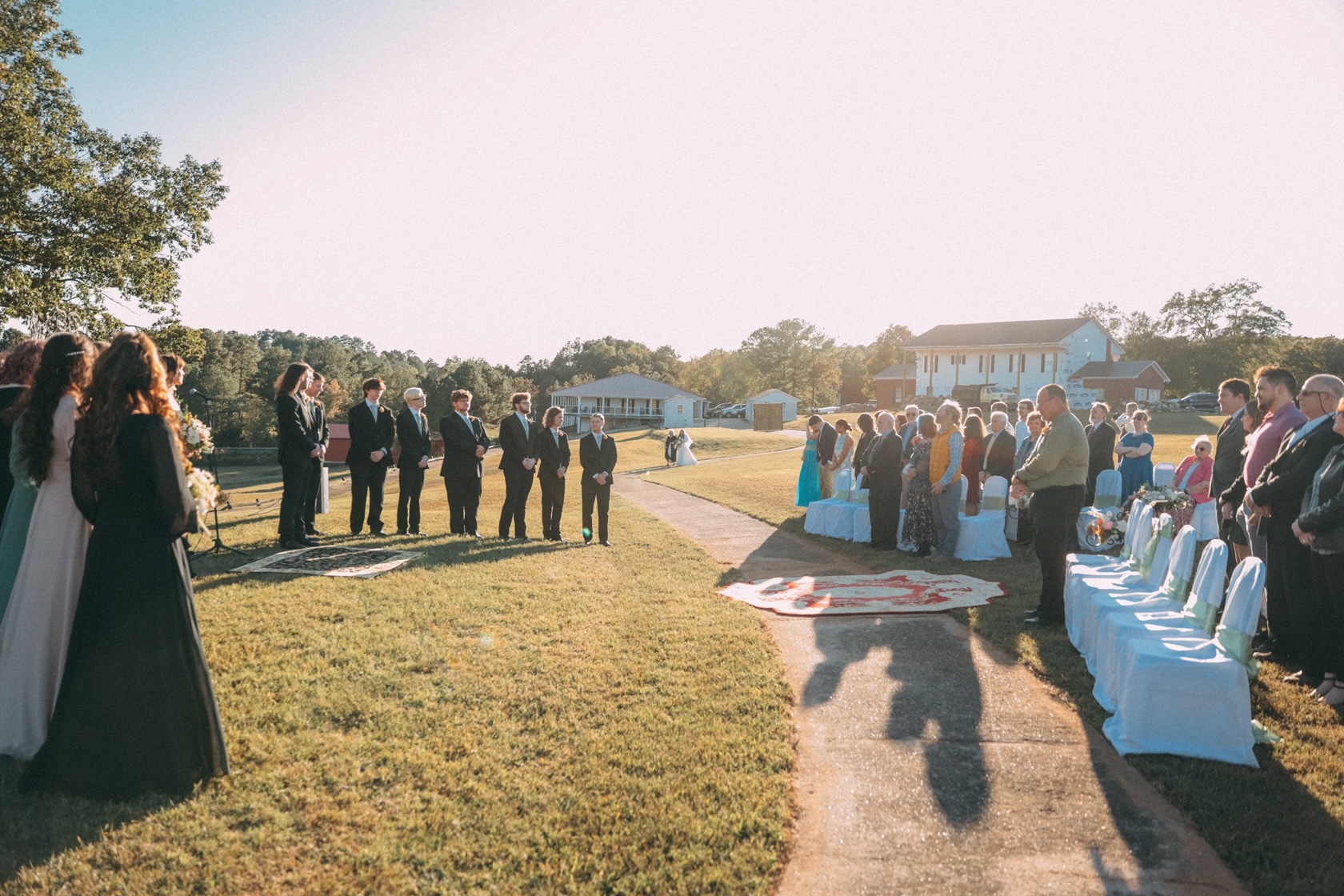 An outdoor wedding ceremony on the grounds at River Hills Retreat
