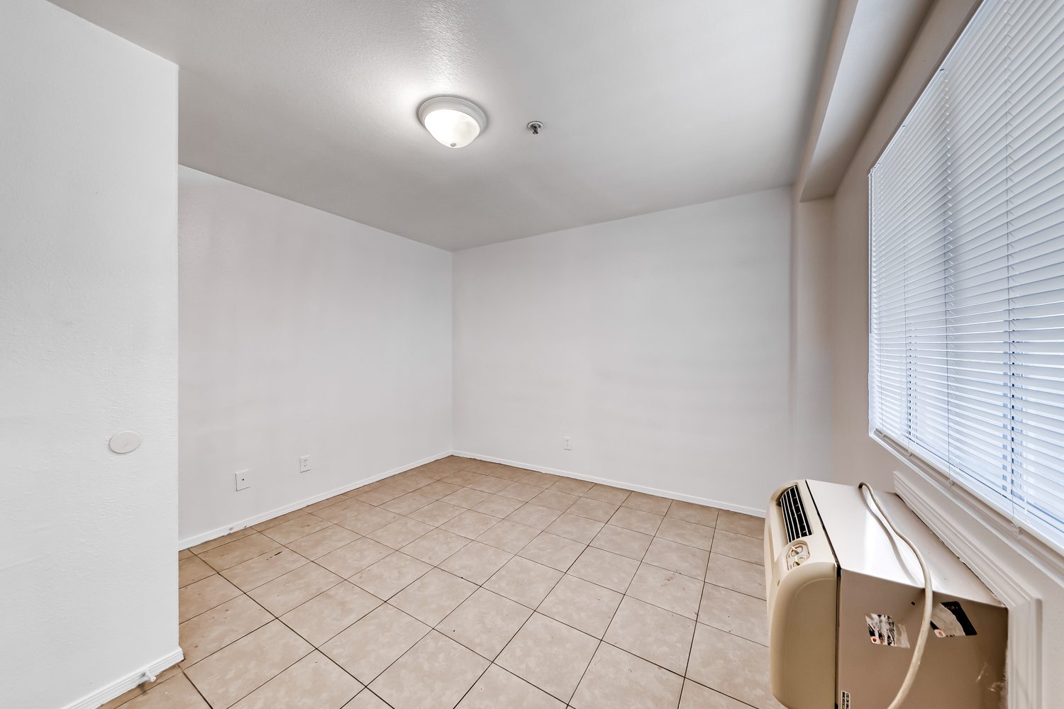 21_bedroom_tile_window_ac
