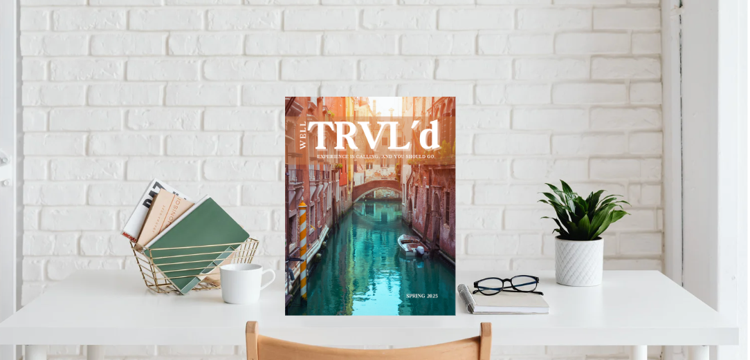 Well TRVL'd Magazine on desk spread