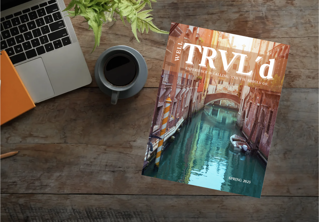 Well TRVL'd Magazine on desk spread