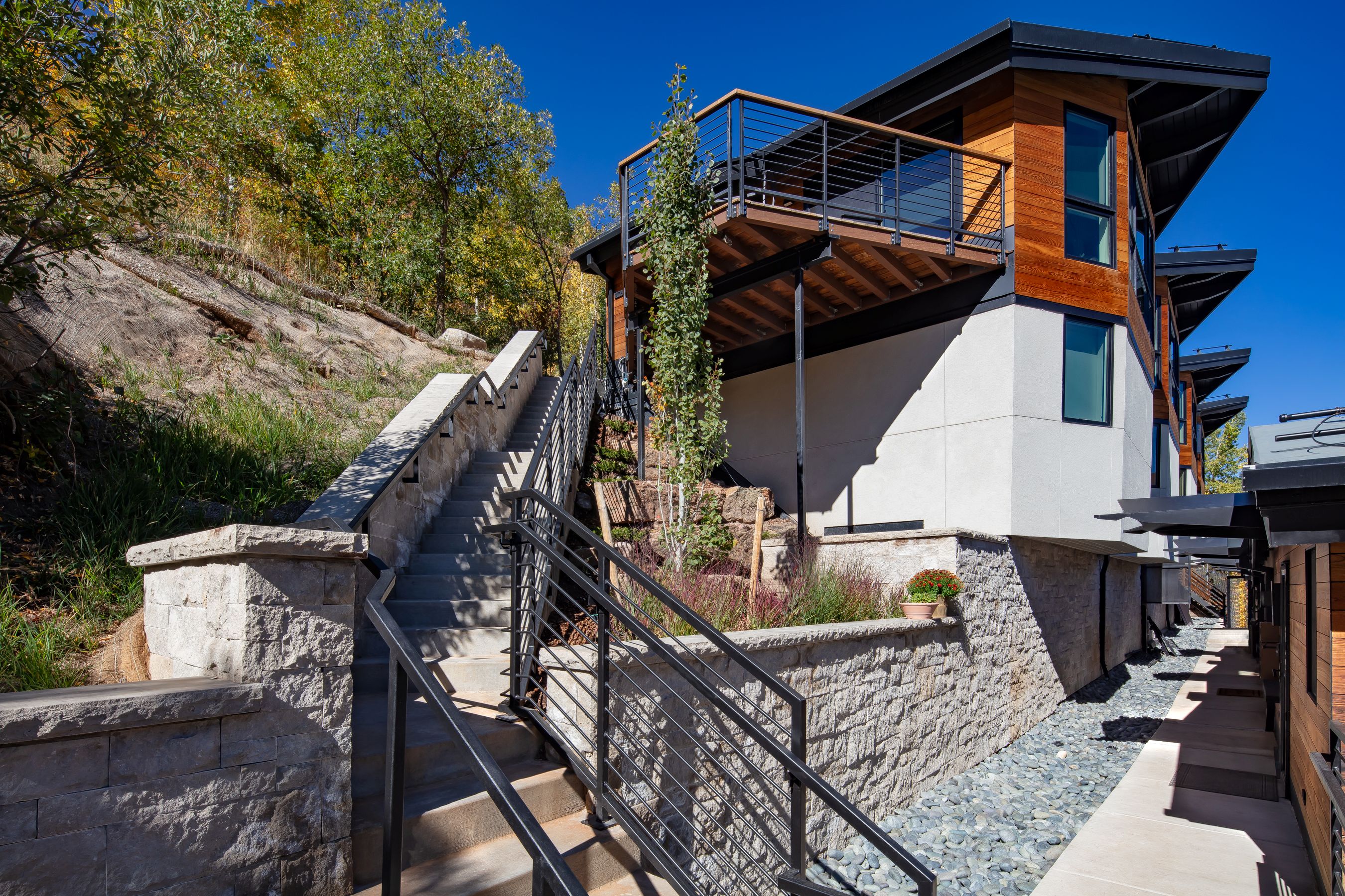 Hillside stairway & cantilevered terrace — Shadow Mountain Townhomes, Aspen, CO