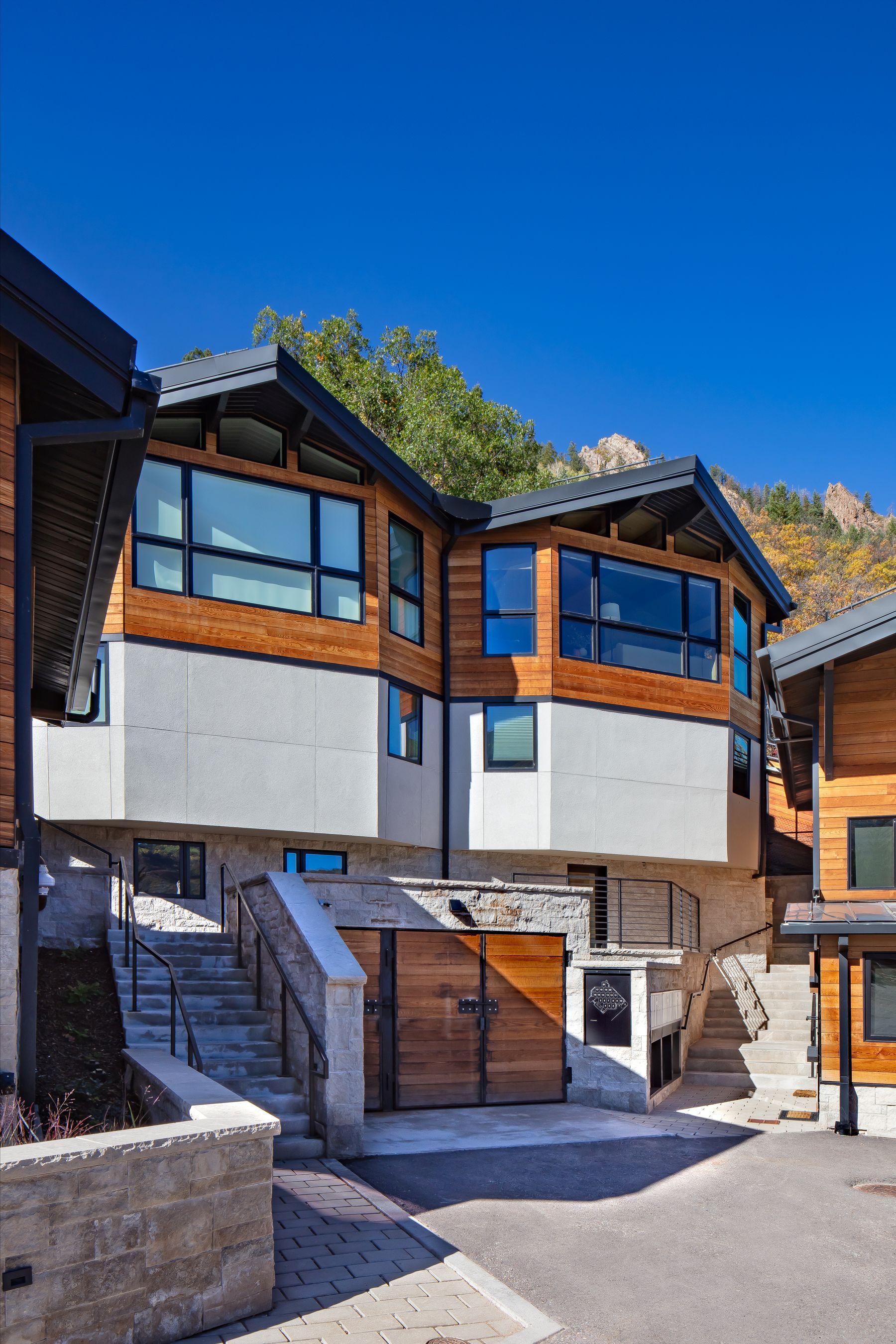 Multi-level alpine facade & stone entryways — Shadow Mountain Townhomes, Aspen, CO