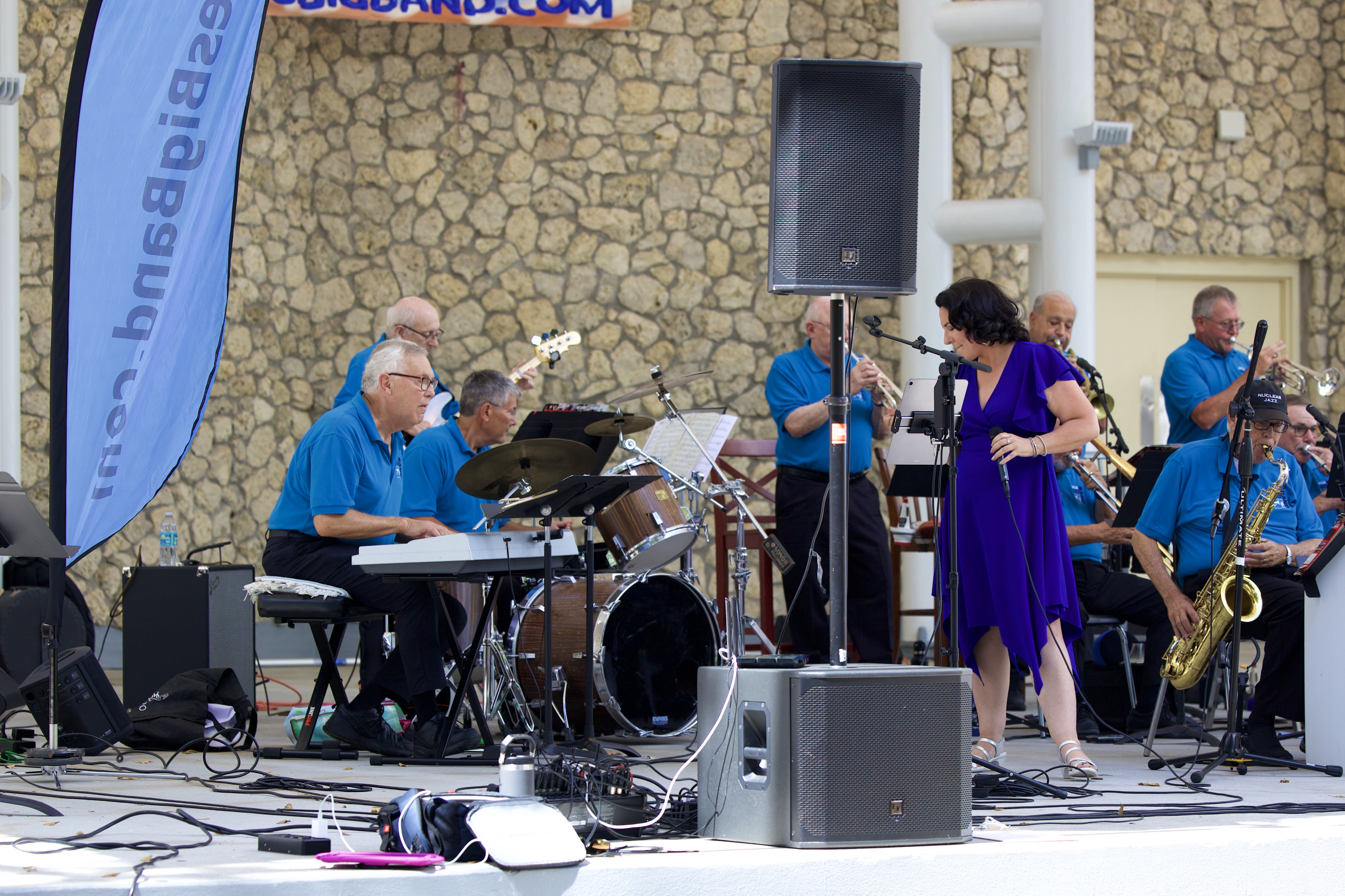 Naples Big Band performing outdoors with guest vocalist and full rhythm section