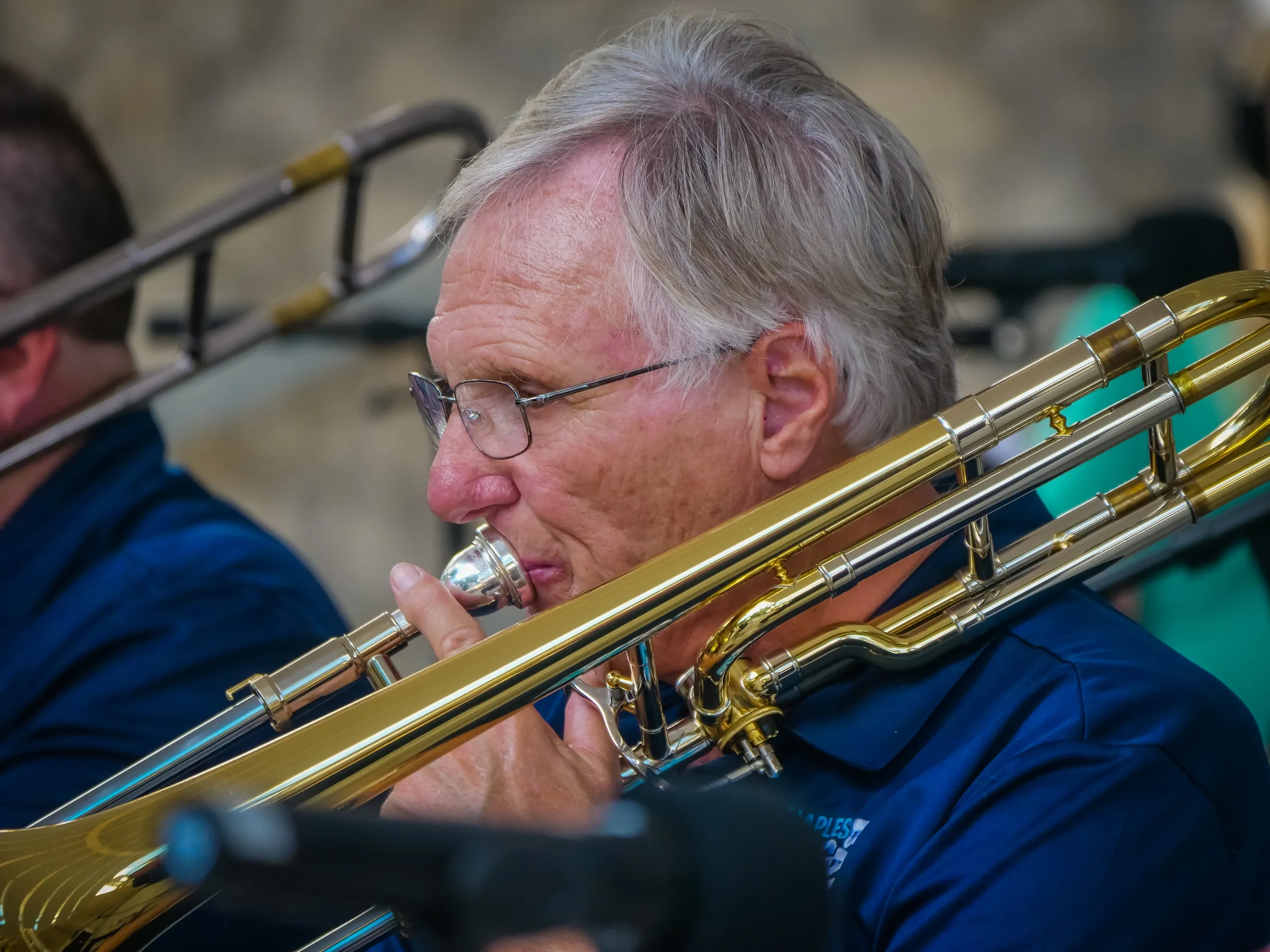Trombone player in action during concert