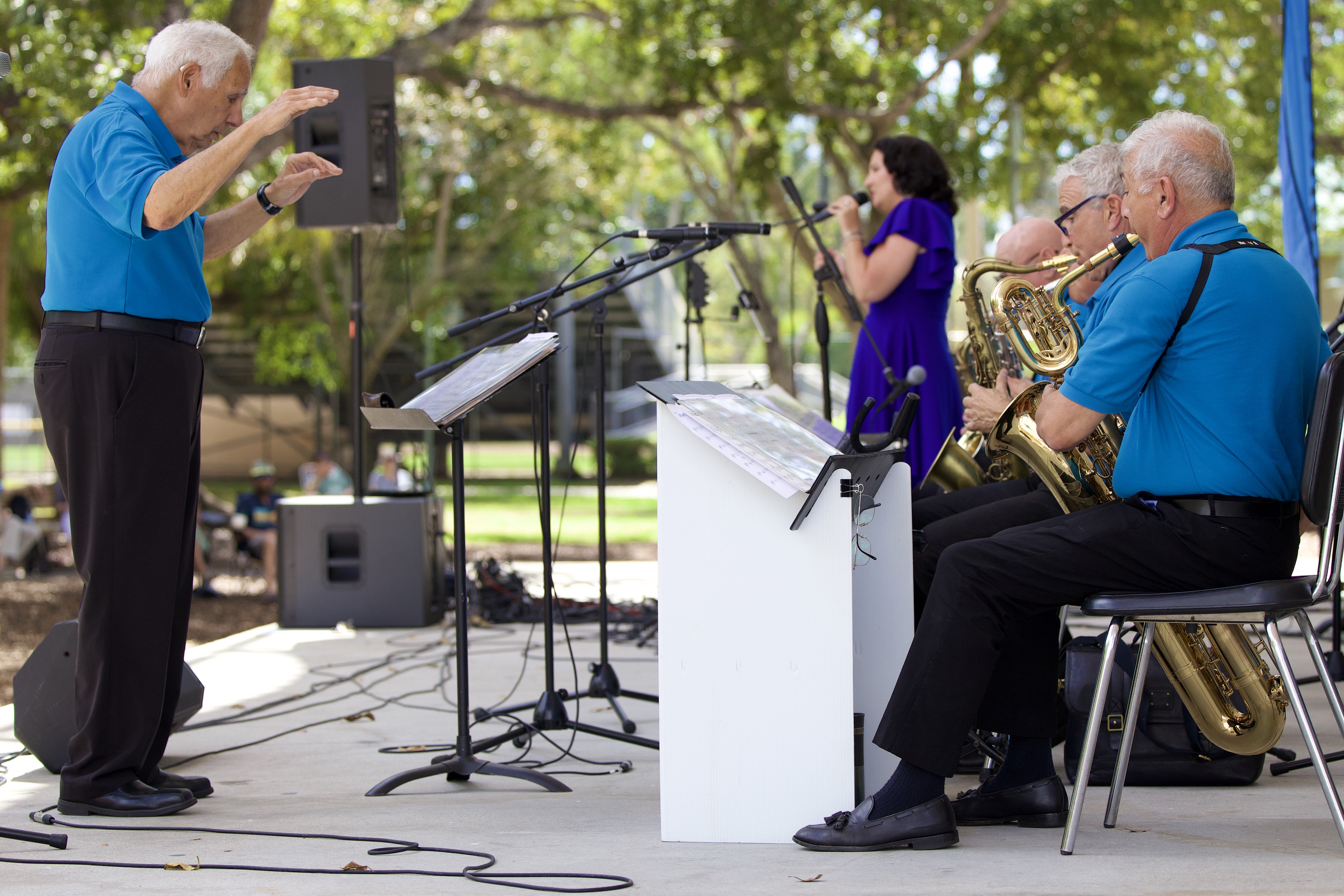 Band director James Castaldi conducting the saxophone section and vocalist live