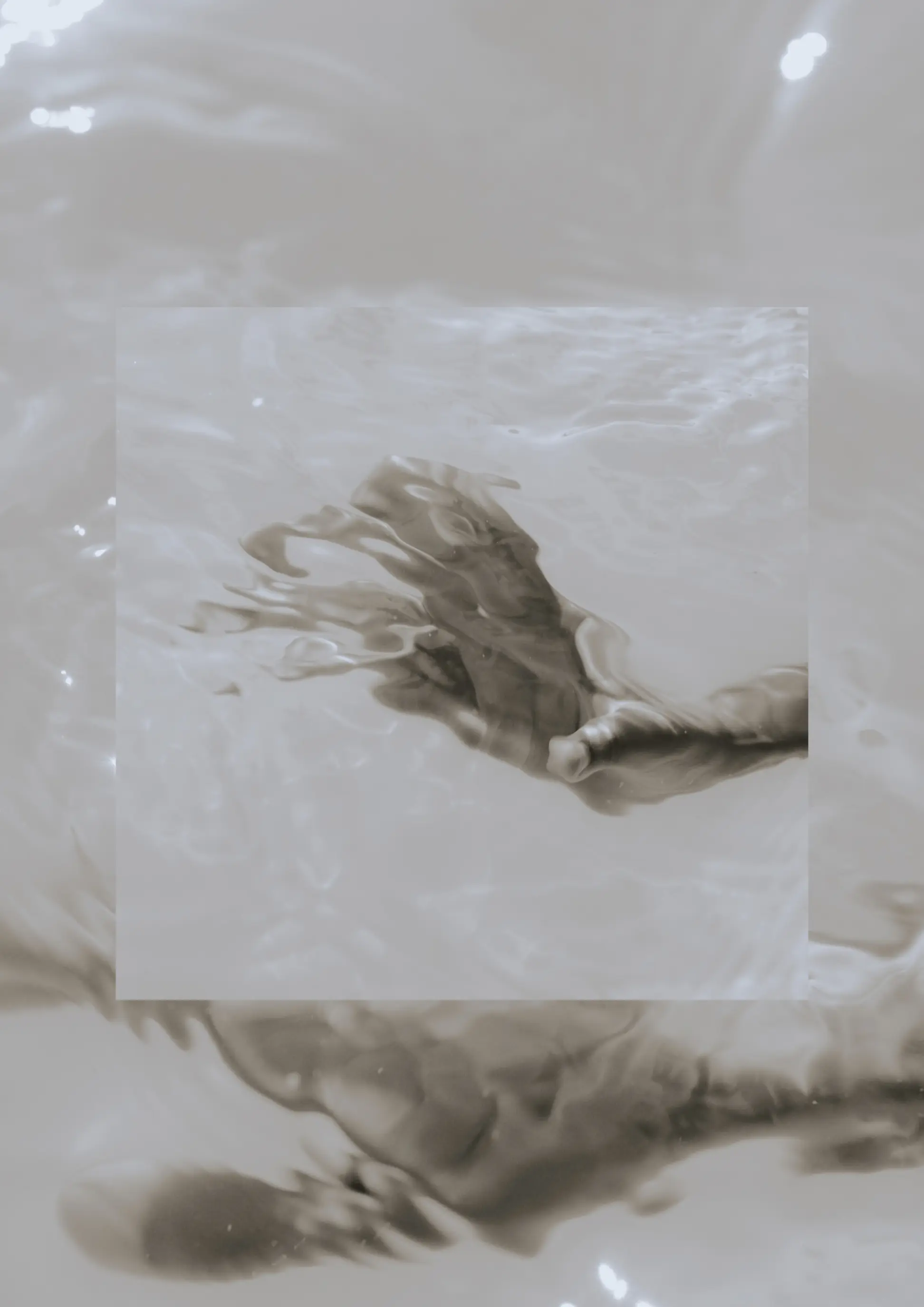 Monochrome hand submerged beneath fluid water ripples with layered central frame