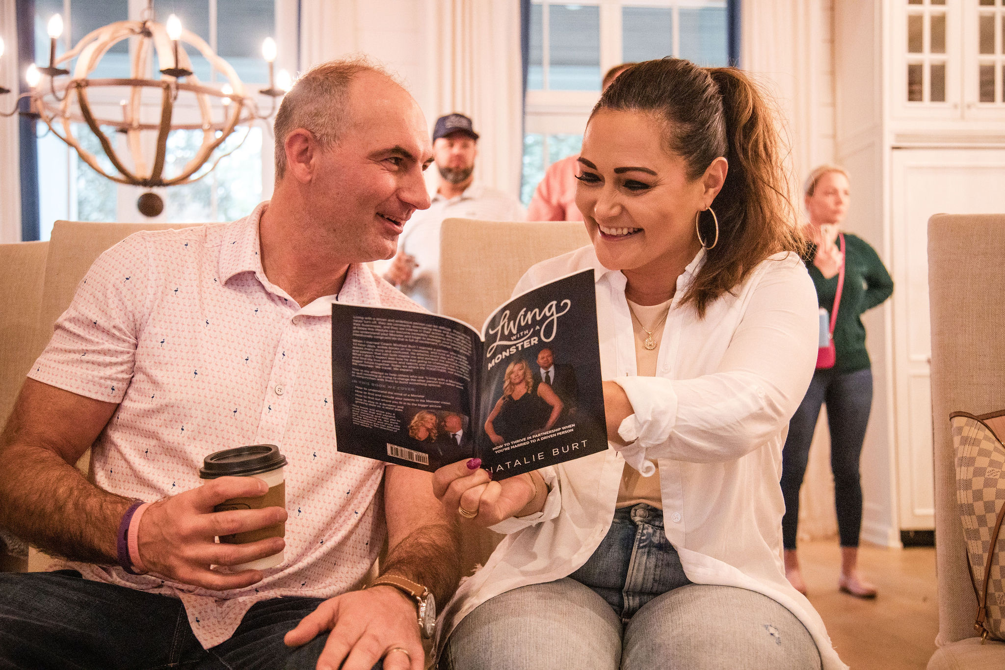 Couples reading the Living with a Monster book together at the retreat