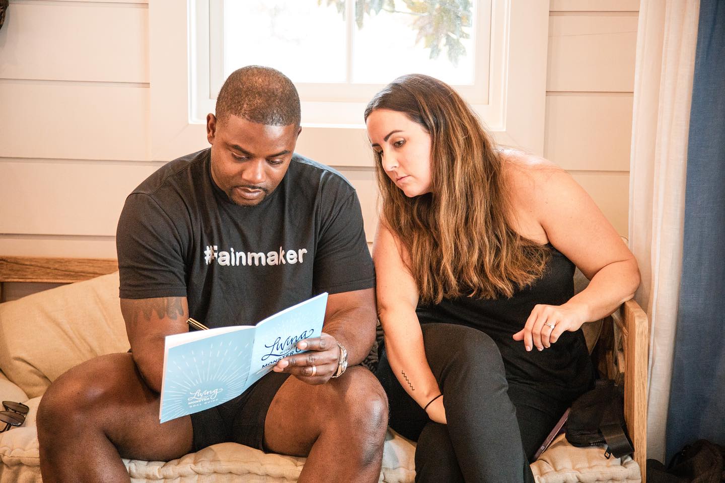 A couple reviewing the Living with a Monster Goal Guide together