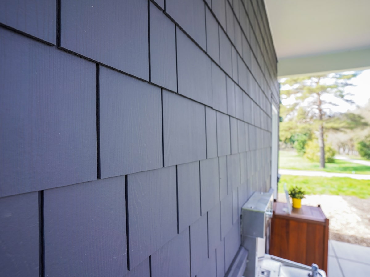 Close-up texture of Charcoal Grey fiber cement shingle siding in Medina WA