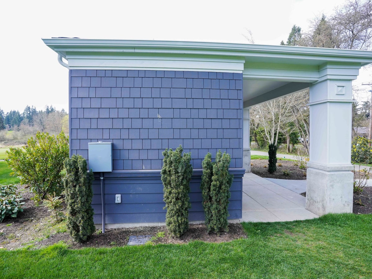 Charcoal Grey fiber cement shingle siding side elevation with covered walkway in Medina WA