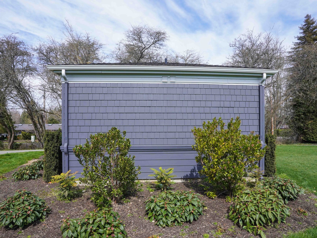 Rear elevation with fiber cement shingle siding and matching lap band in Medina WA