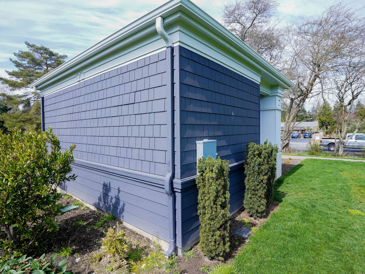 Fiber cement shingle siding with lap siding band on a Medina WA estate exterior
