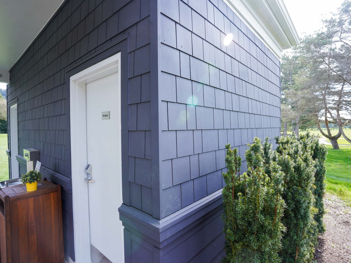 Portico entry and corner detail with Charcoal Grey fiber cement shingle siding