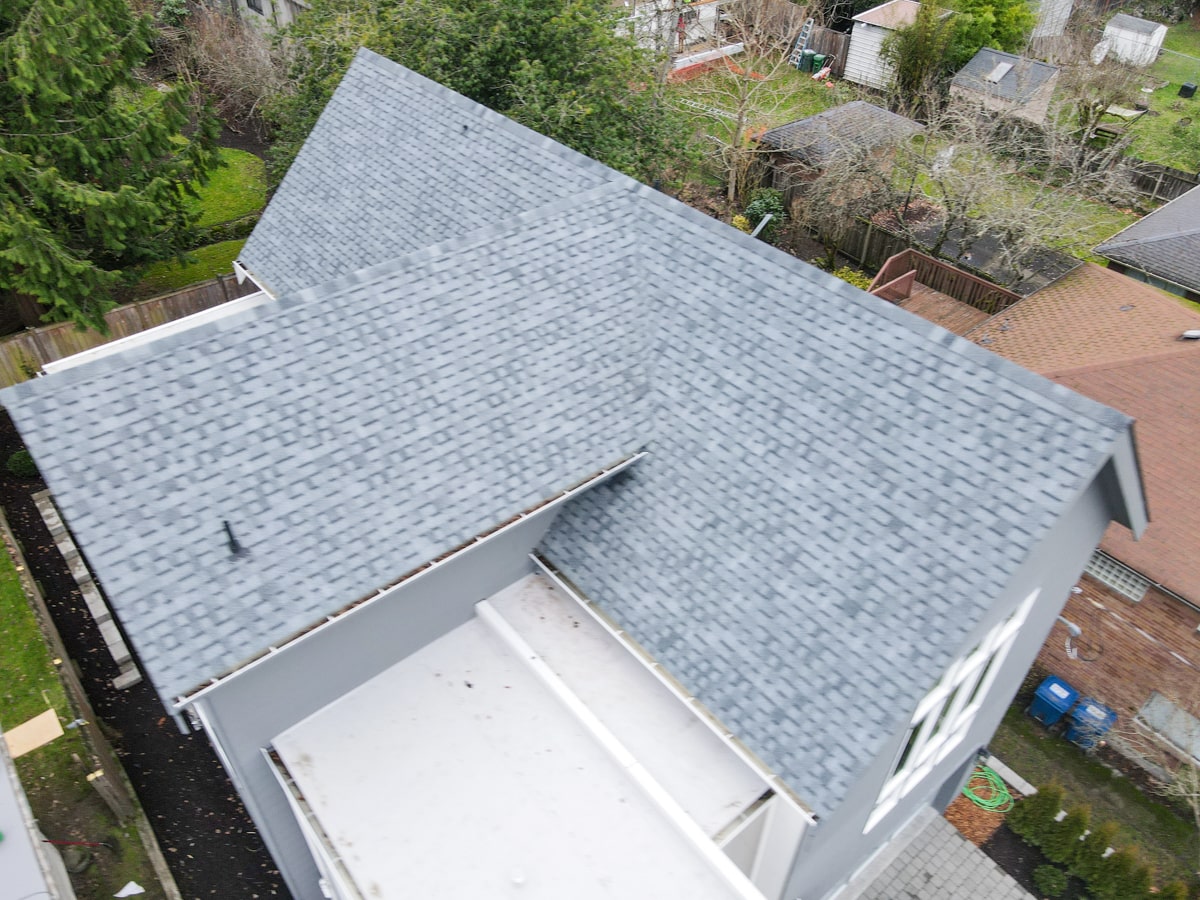Architectural shingle roof ridge and valley detail on a Seattle WA home