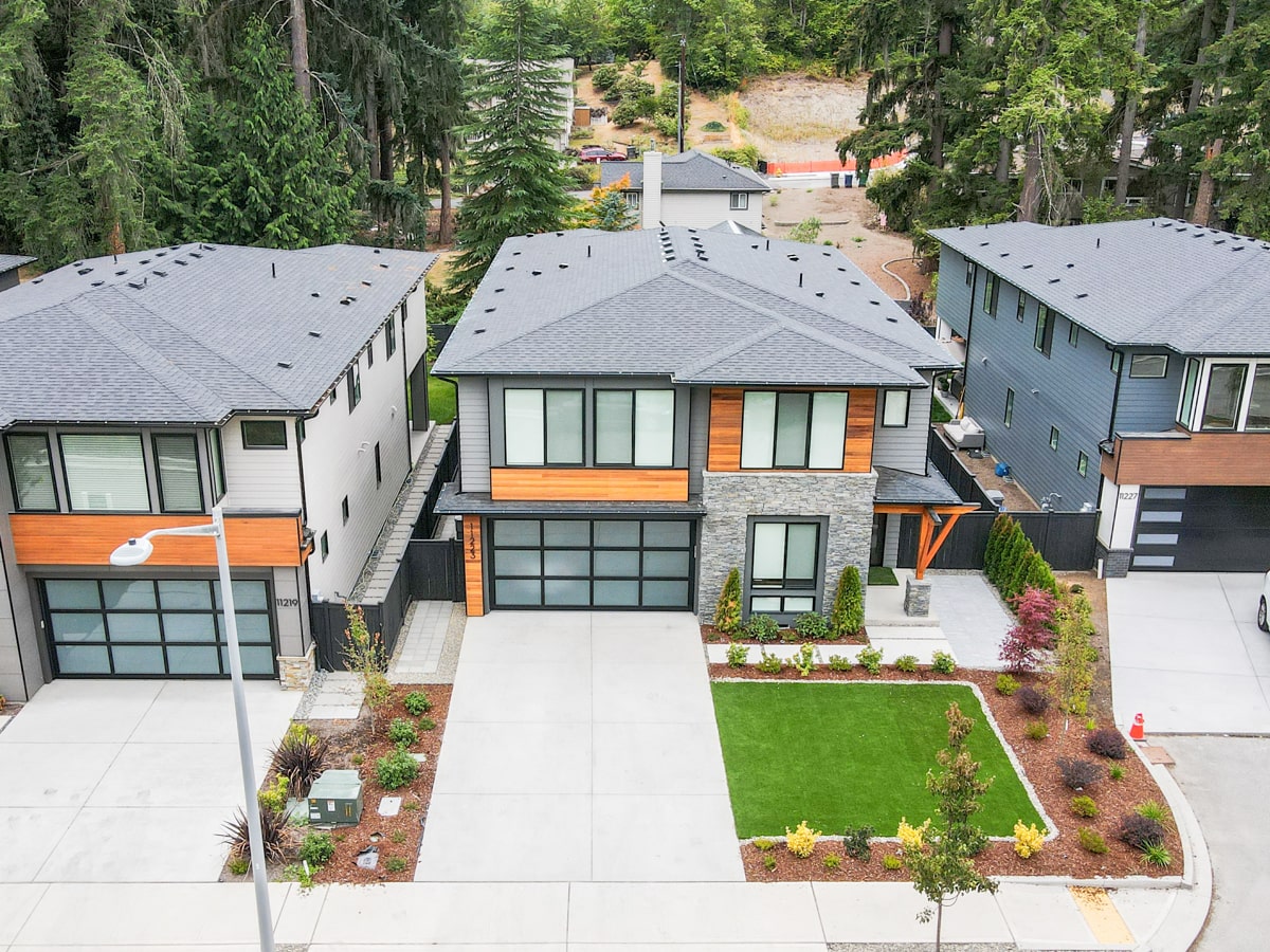 Wide front view of cedar siding installation on a new construction home in Kirkland WA