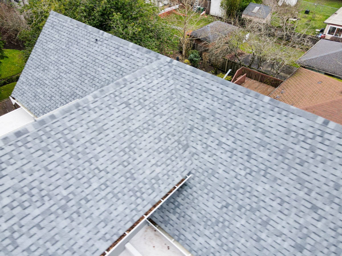 Close-up of light gray architectural shingle roof installation in Seattle WA