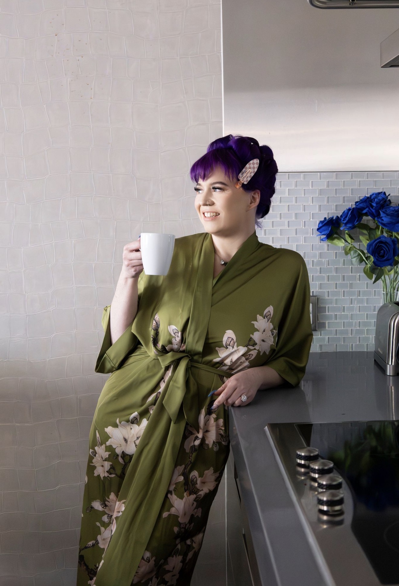 Shenelle smiling with coffee — ready for your next step