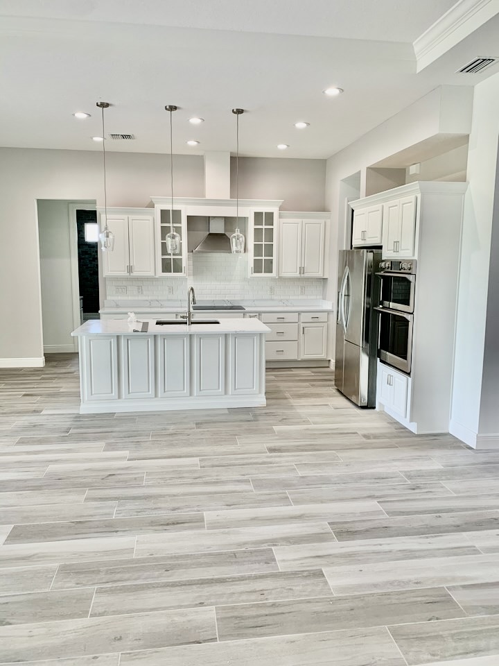Open-Concept Chef's Kitchen & Wide-Plank Tile — Remodeling, Tampa Bay, FL