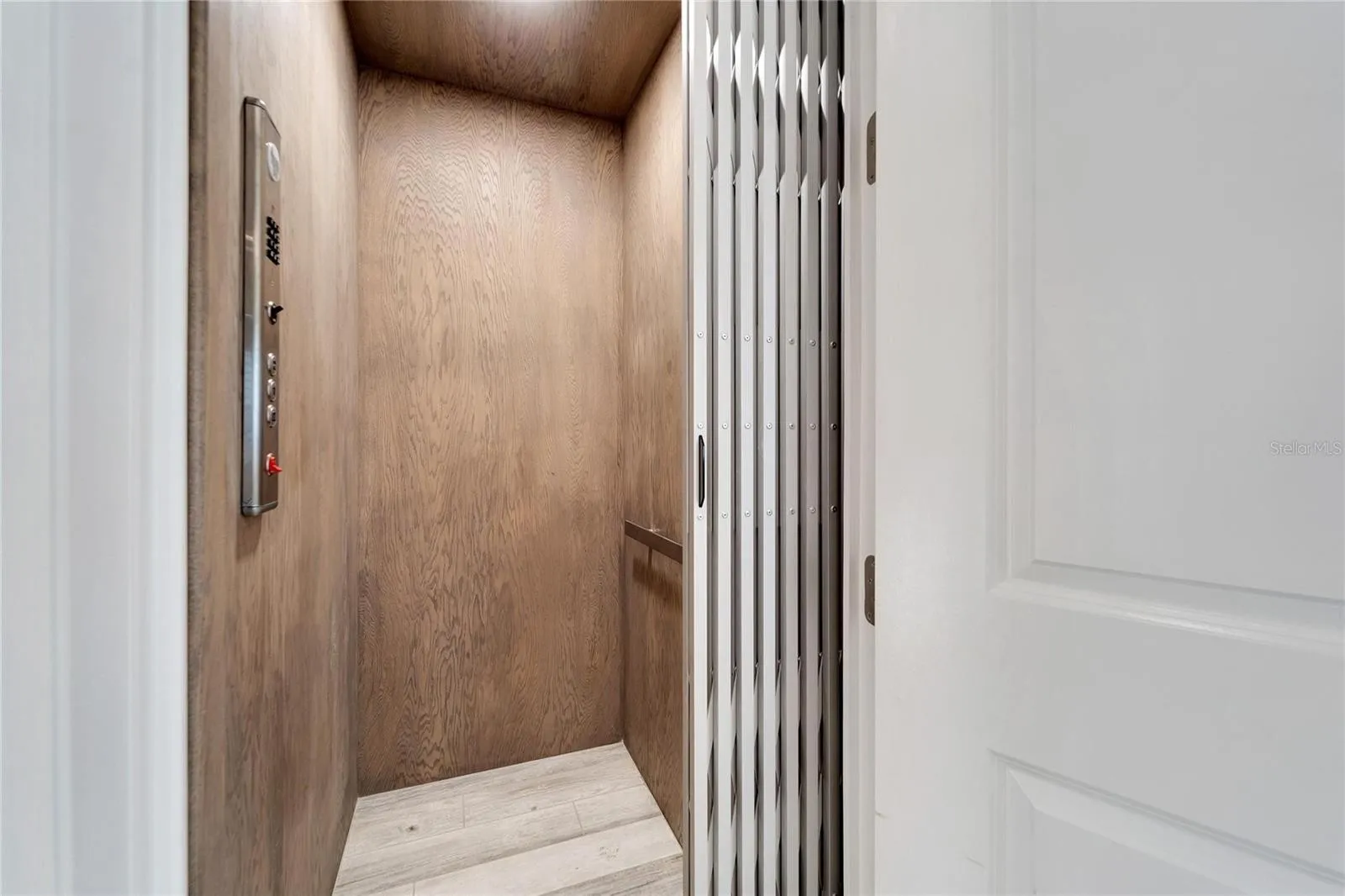 Residential In-Home Wood-Paneled Elevator — Custom Home, Madeira Beach, FL