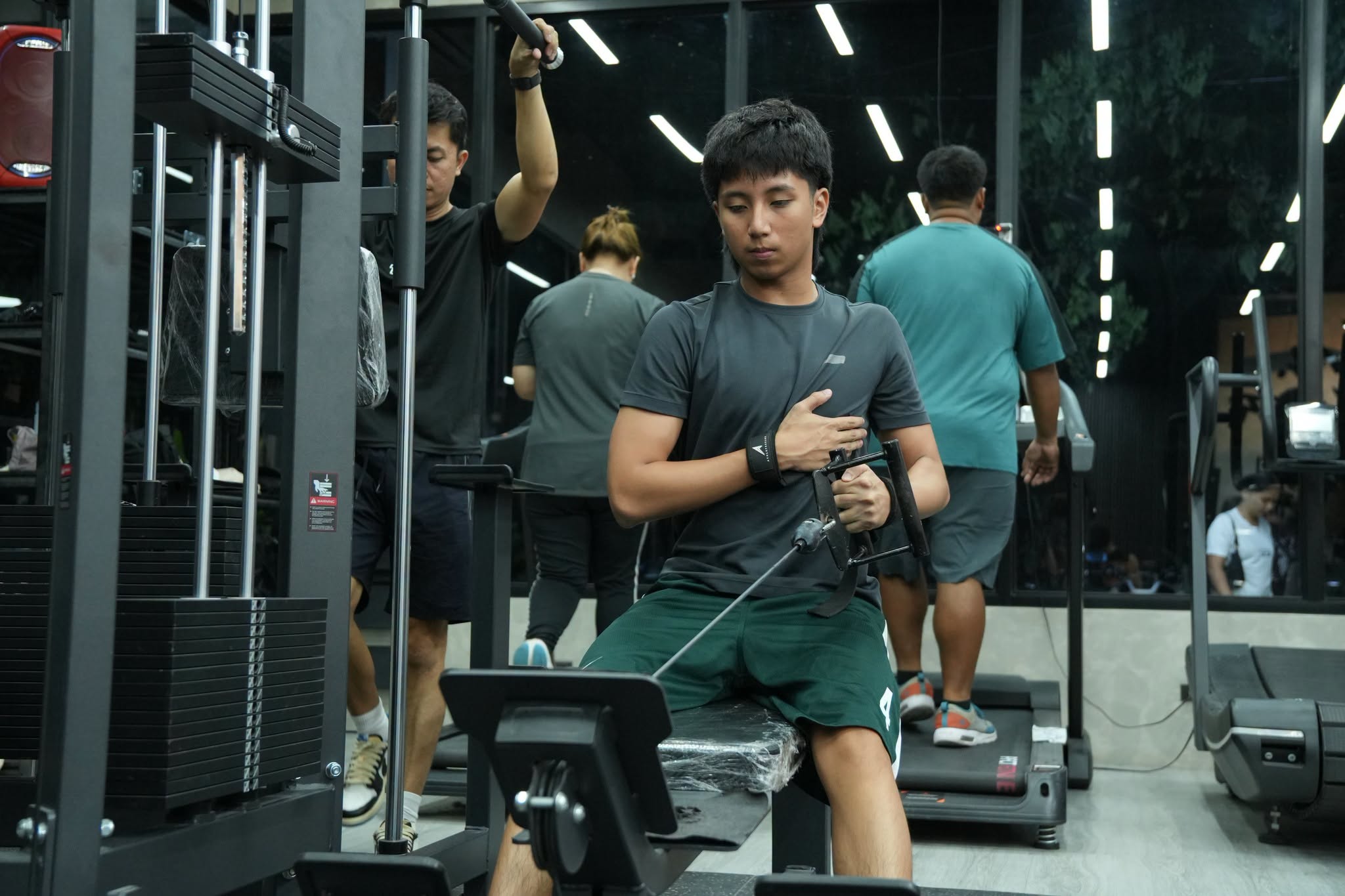 Pin-loaded and cable machine stations at True Strength Fitness gym in Becuran, Sta. Rita