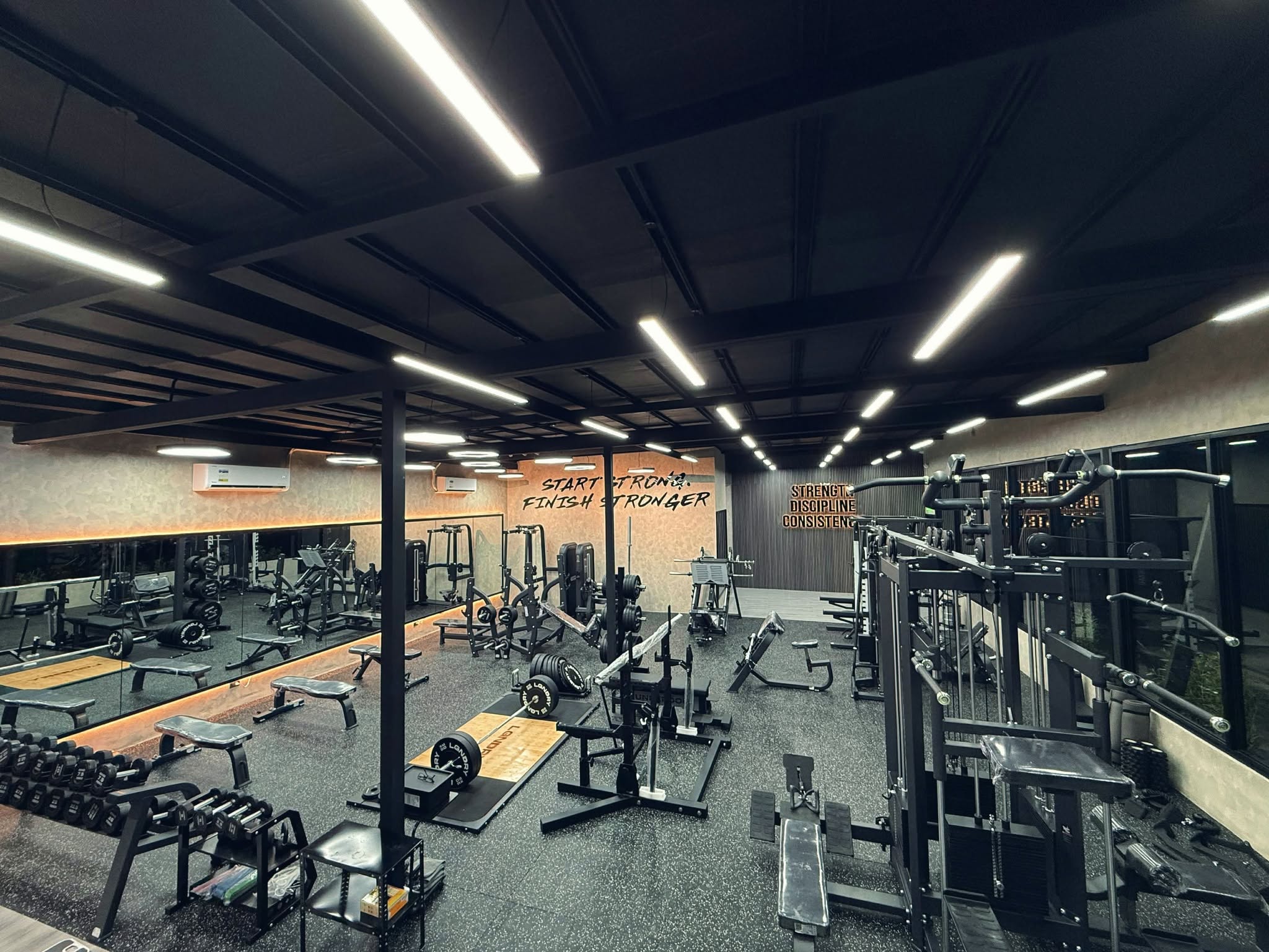 True Strength Fitness gym interior with power cages and free weights in Becuran, Sta. Rita, Pampanga