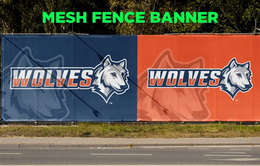 Mesh fence banners for a sports team along a roadside fence