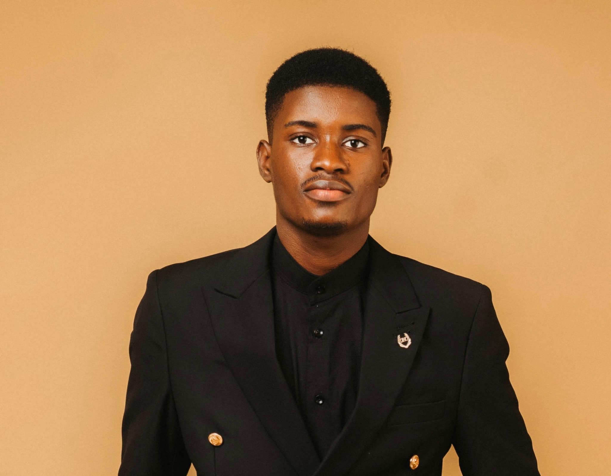 Daniel Kayode portrait in black blazer