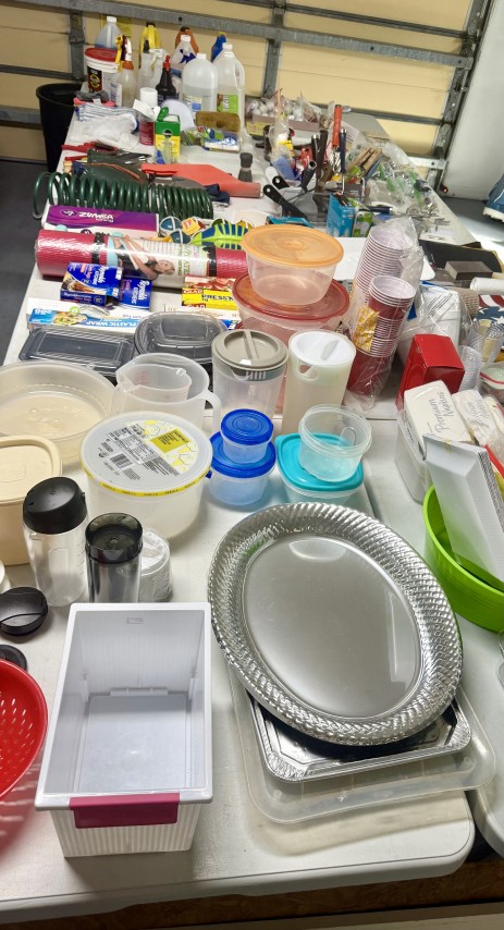 Assortment of food storage containers, serving platters, plastic drinkware, and household goods
