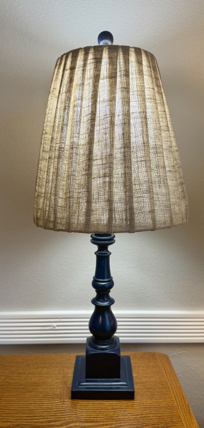 Navy blue spindle table lamp with pleated linen lampshade