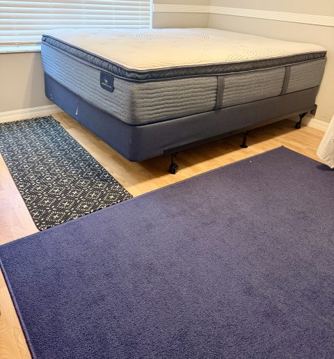 Serta pillowtop mattress and box spring set on wheeled metal bed frame