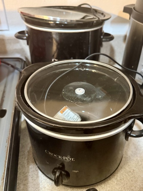 Crock-Pot slow cooker with glass lid on kitchen counter