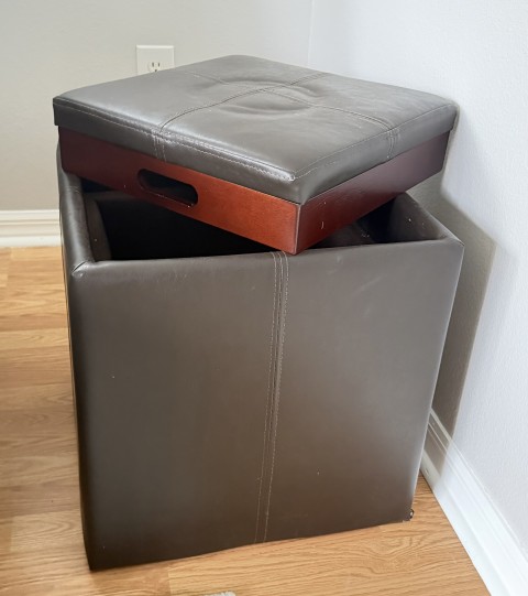 Brown leather cube storage ottoman with reversible wood serving tray lid