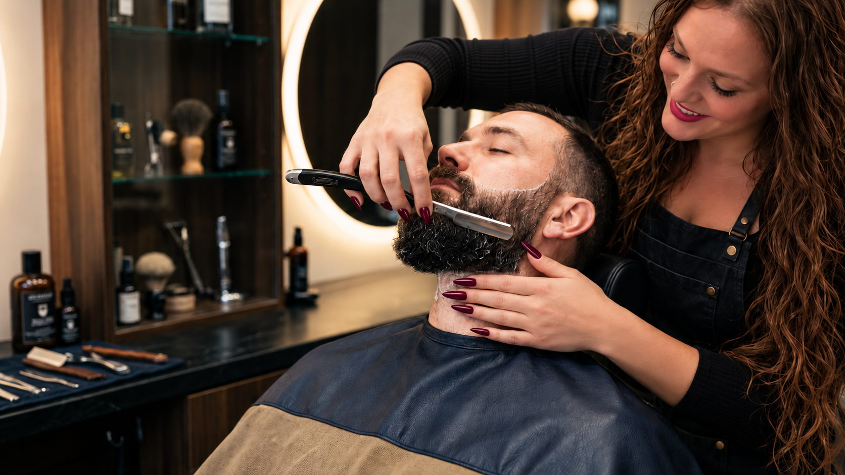 Alexys performing a precision straight-razor hot shave and beard grooming service at MANE DISTRICT