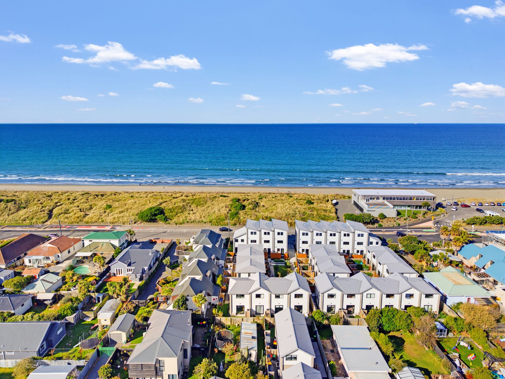 2/180 Marine Parade open-plan living and balcony