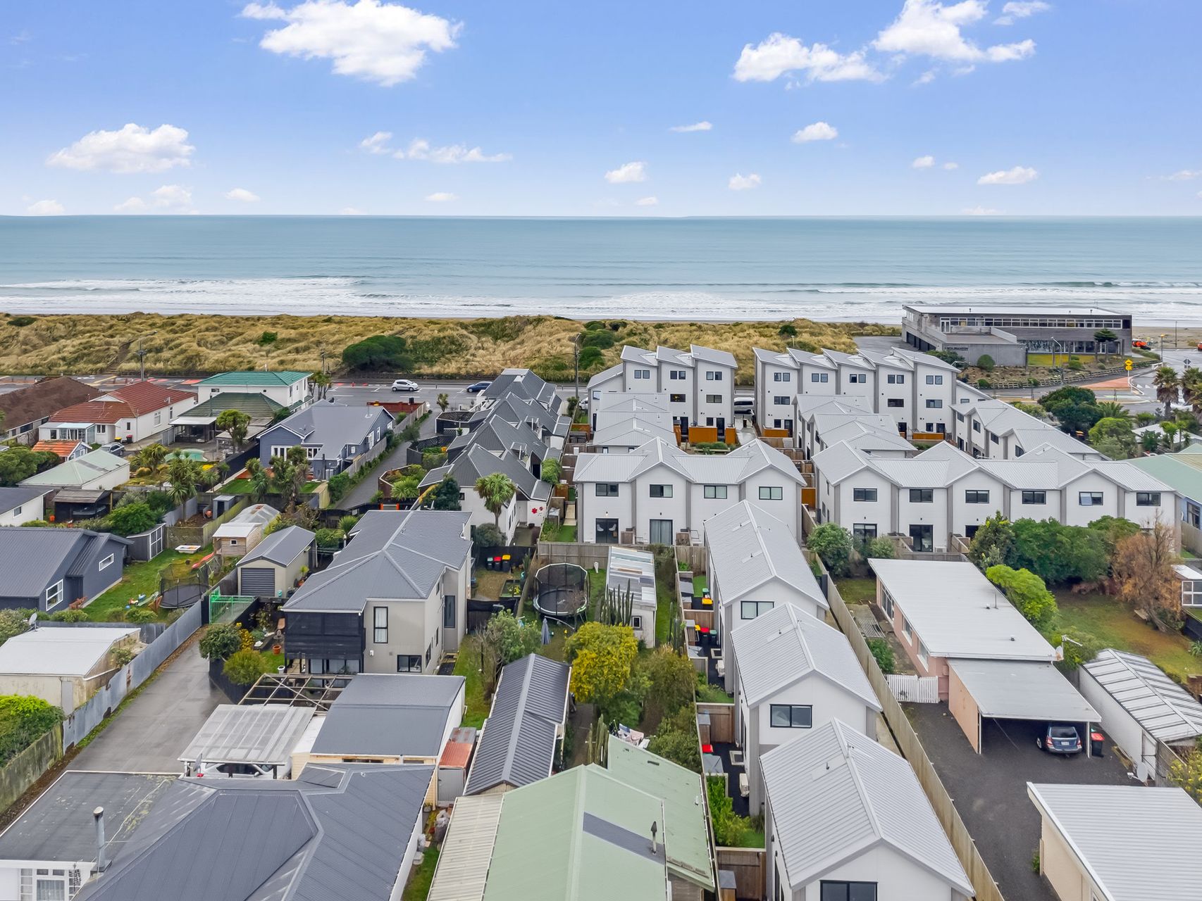 23/180 Marine Parade, New Brighton development aerial towards the sea