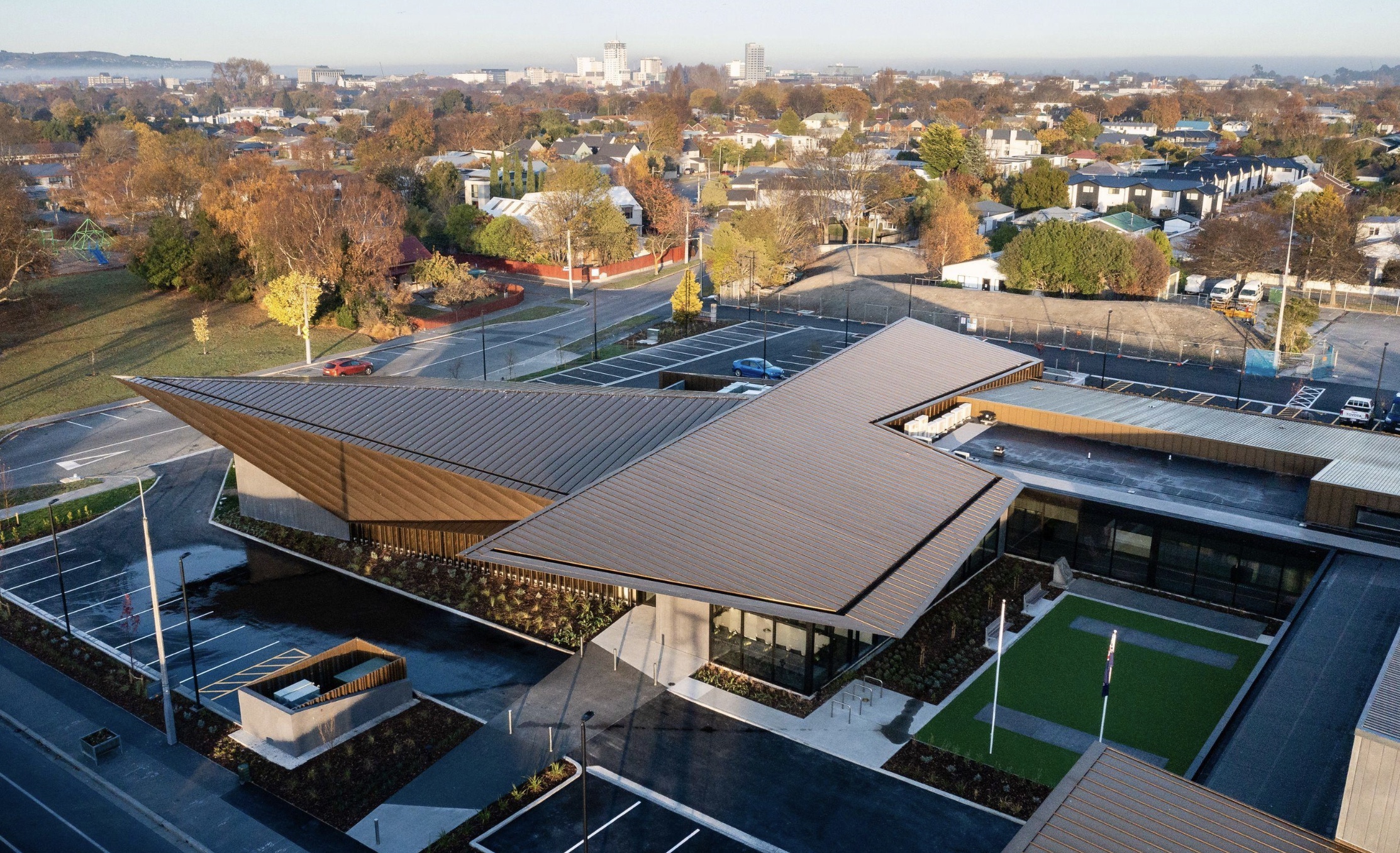 Modern community building and aerial view over Richmond towards Christchurch CBD
