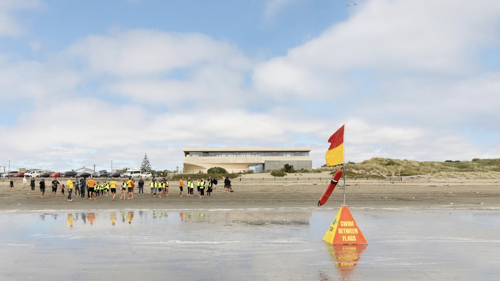 New Brighton Surf Life Saving Club patrolling the beach with patrol flags