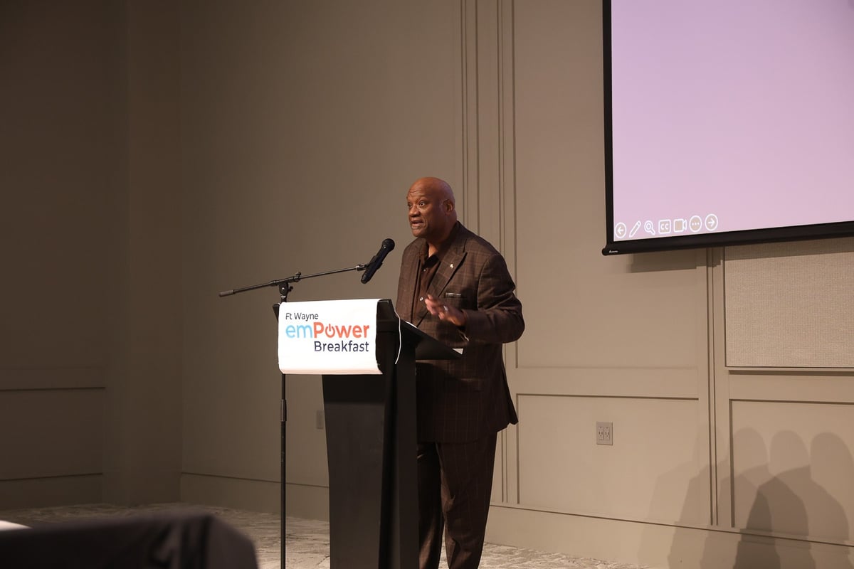 A speaker addresses the audience from a podium at the Fort Wayne emPower Breakfast.