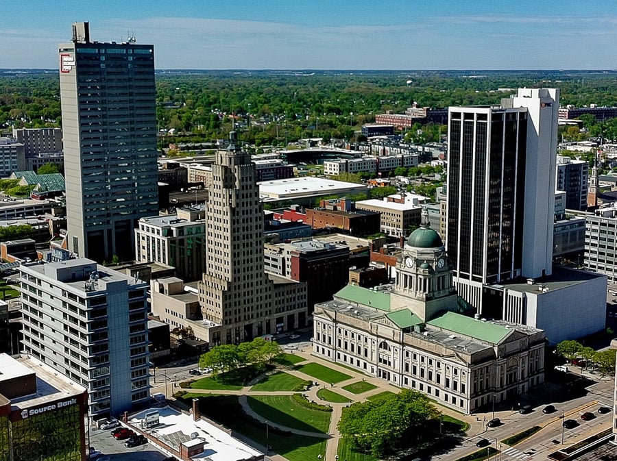 Aerial view of downtown Fort Wayne featuring the Allen County Courthouse and historic buildings.