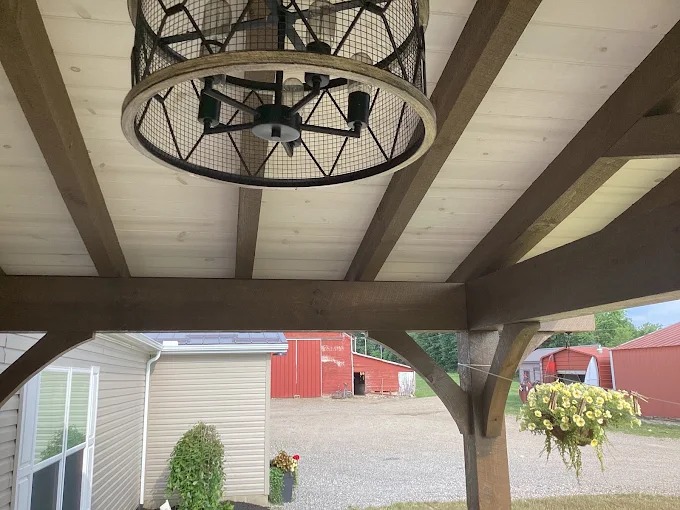 Precut and prestained timber rafters and tongue-and-groove porch ceiling detail in Rutledge, TN