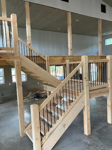 Handcrafted interior timber staircase and loft framing in custom home, Rutledge, TN by Sunrise Builders 4 LLC