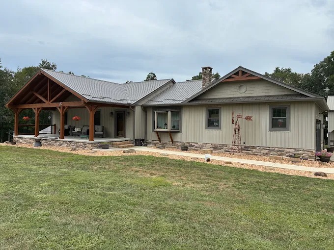 Residential timber frame porch and decorative gable web accent under metal roof in Rutledge, TN